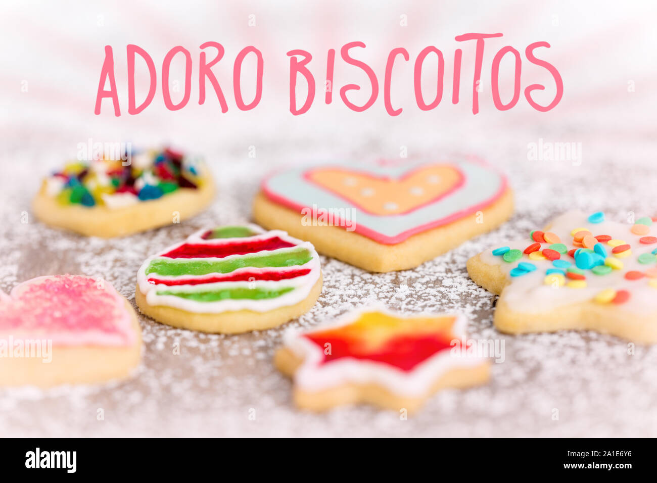 sweet and colorful cookies on icing sugar background, spanish Text