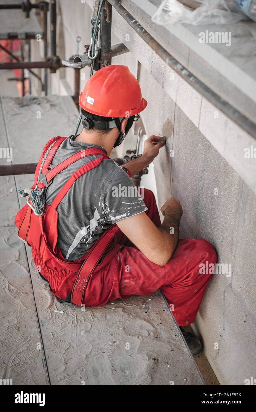 Red cement mix and trowel on the construction site Stock Photo - Alamy