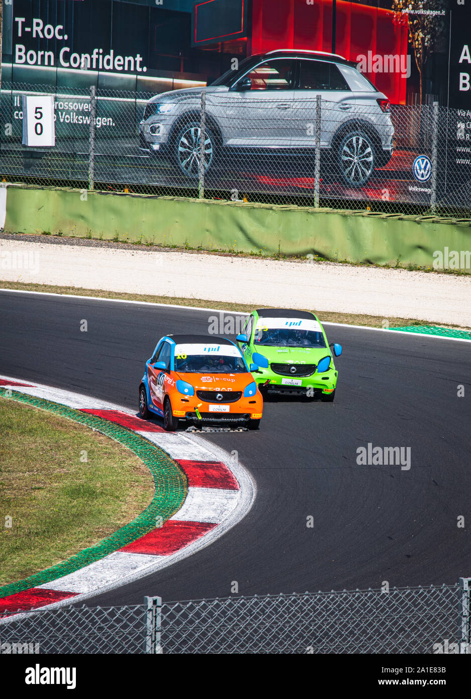 Vallelunga, Italy september 14 2019. High angle view of asphalt circuit with two Smart electric engine racing car in overtaking  action during the rac Stock Photo