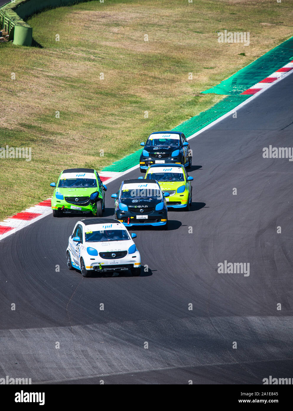 Vallelunga, Italy september 14 2019. High angle view of asphalt circuit with Smart electric engine racing cars in group action and overtaking during t Stock Photo