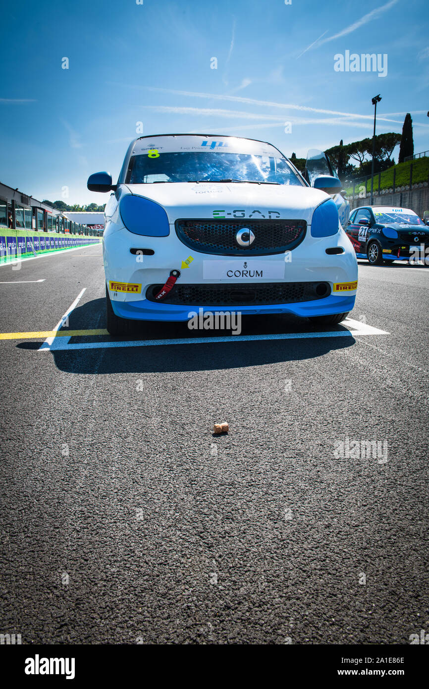 Vallelunga, Italy september 14 2019. Low angle view of Smart fortwo electric engine racing car in grid with wine cork in front of for good luck charm Stock Photo