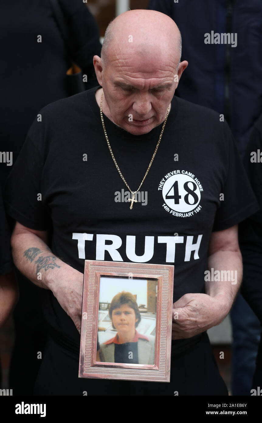 Eugene Kelly, looks at a photo of his 17-year-old brother Robert who died in the 1981 Stardust fire, as some of the families of the victims of the fire hold a press conference about the new inquest at Buswells Hotel in Dublin. Stock Photo