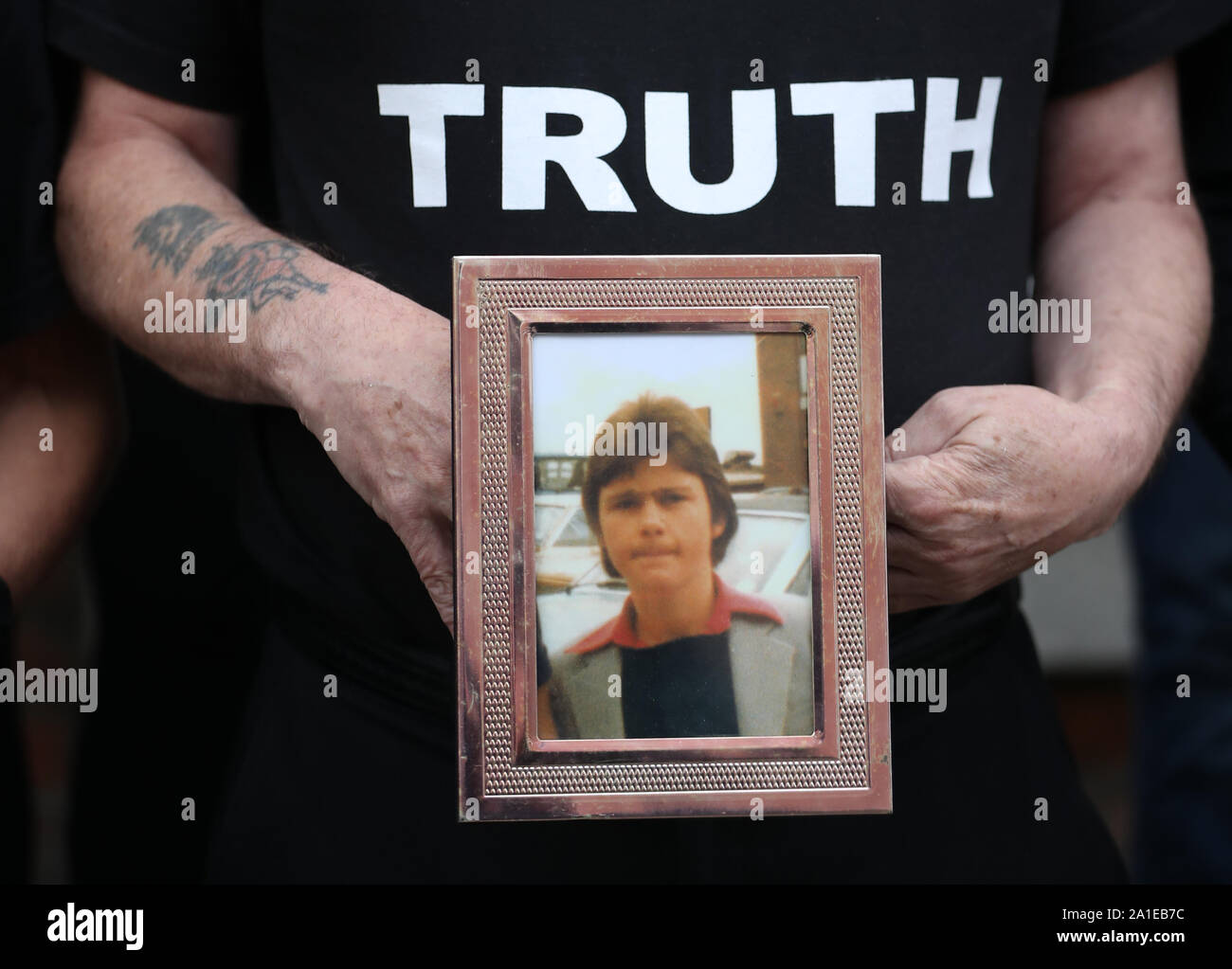 Eugene Kelly, holds a photo of his 17-year-old brother Robert who died in the 1981 Stardust fire, as some of the families of the victims of the fire hold a press conference about the new inquest at Buswells Hotel in Dublin. Stock Photo