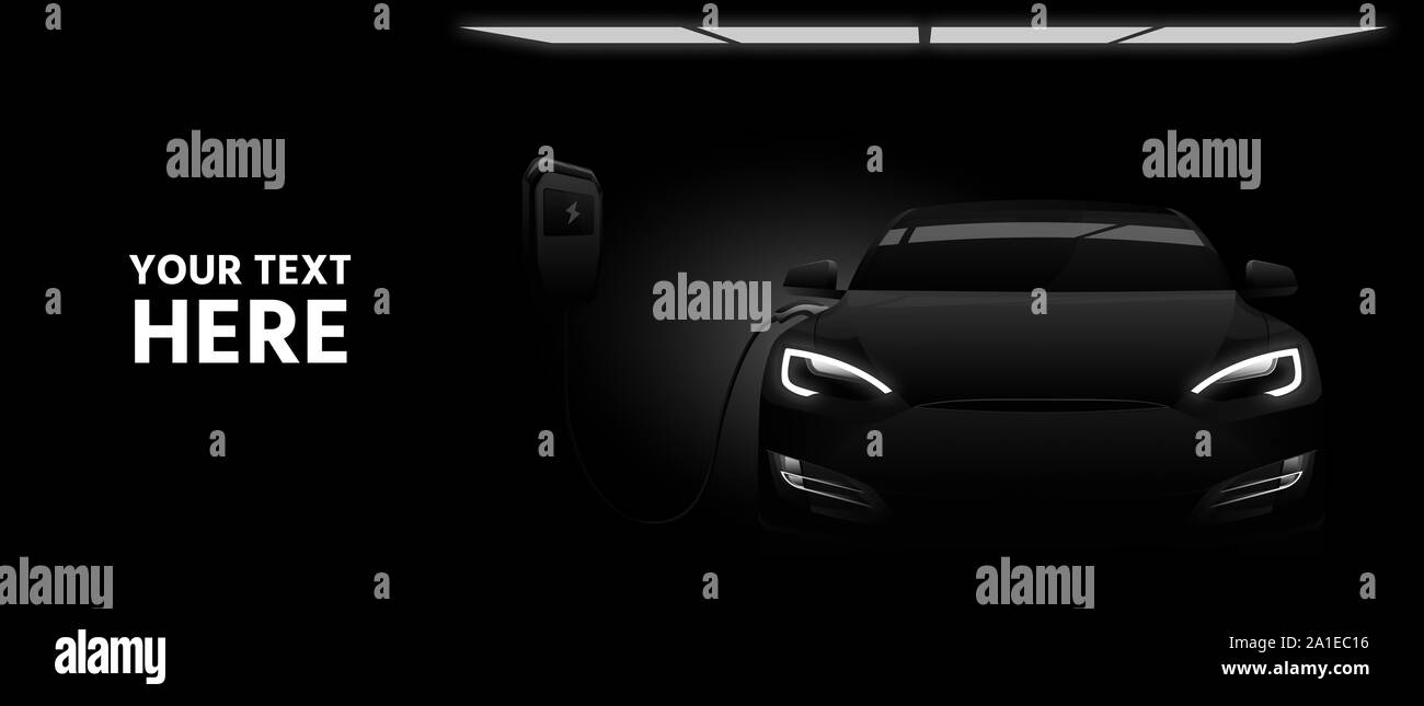 Black electric car with a charging station in the dark. Stock Photo