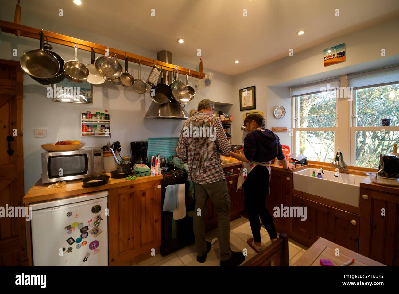 Father and daughter baking in kitchen Stock Photo