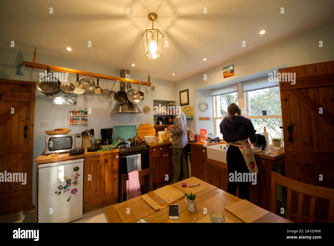 Father and daughter baking in kitchen Stock Photo