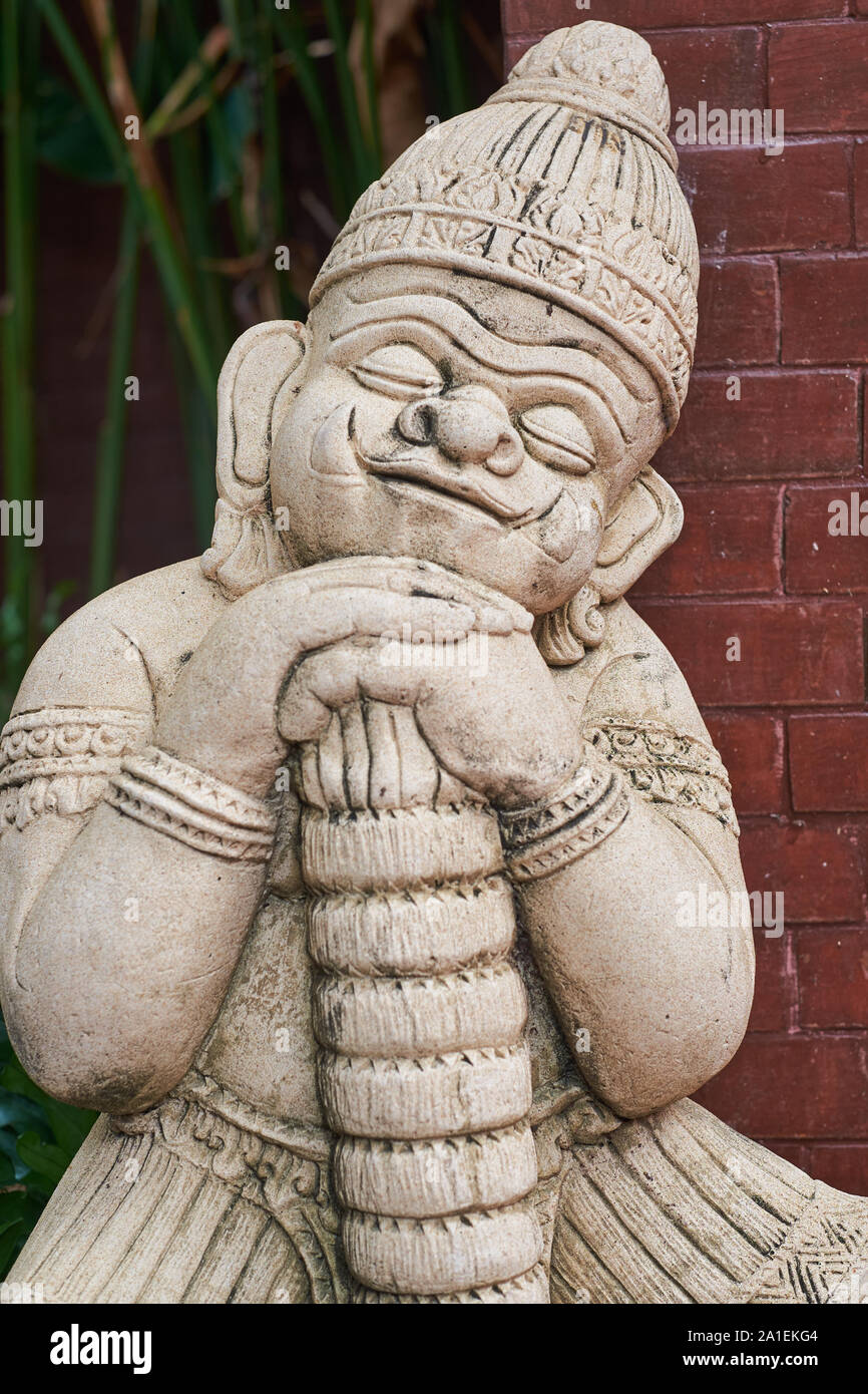 A mini / baby version of a Yak, a benevolent guardian demon, Bangkok, Thailand; such figures are often used as decoration, somewhat like garden gnomes Stock Photo