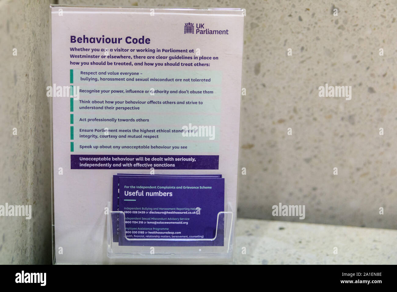 Behaviour Code for visitors and staff of the UK Parliament, printed leaflet on display, London, UK Stock Photo