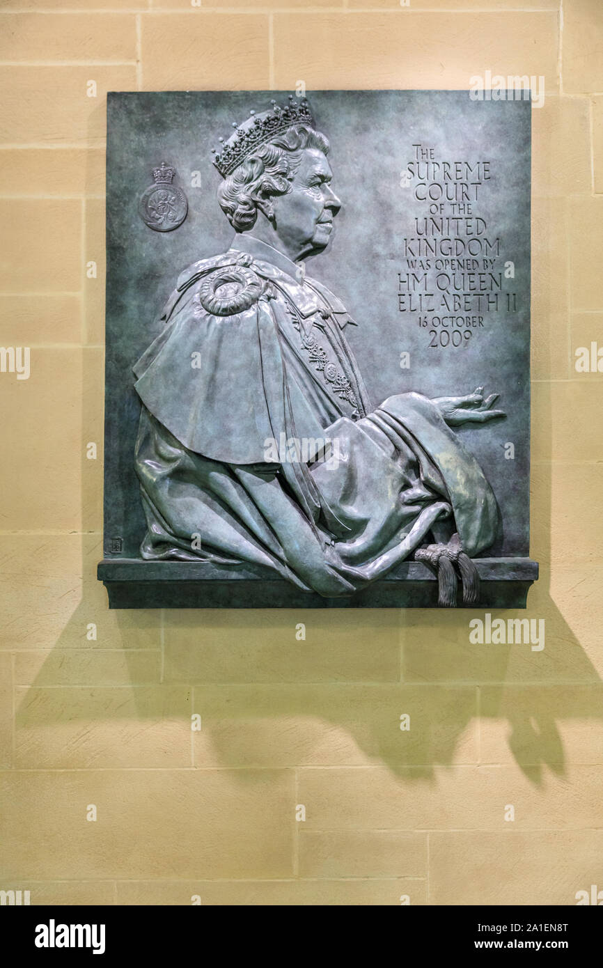 Commemorative stone plaque of Queen Elizabeth II, on a wall at the Supreme Court of the United Kingdom, London, UK Stock Photo