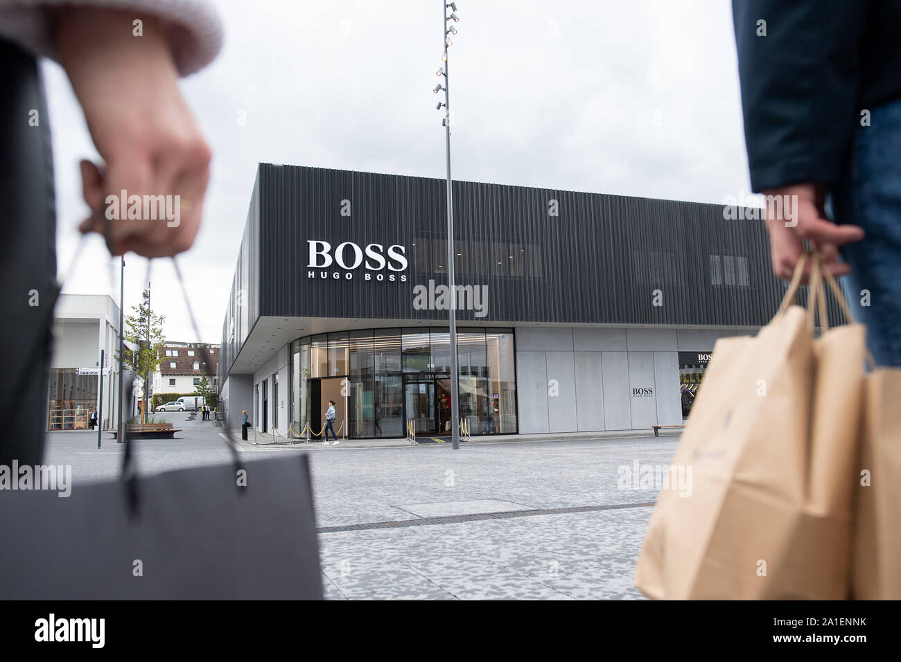 26 September 2019, Baden-Wuerttemberg, Metzingen: Sweaters with the  inscription "Hugo Boss" are in the new flagship outlet of Hugo Boss in the  Outlet-City. The outlet will officially open on 26 September. Photo: