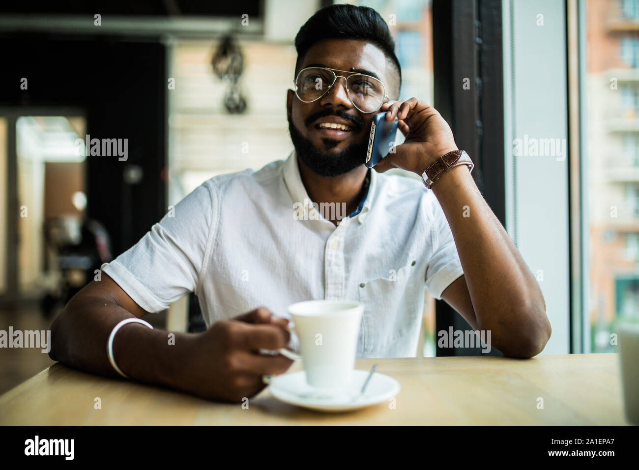 Young Asian Casual businessman talking on phone Stock Photo