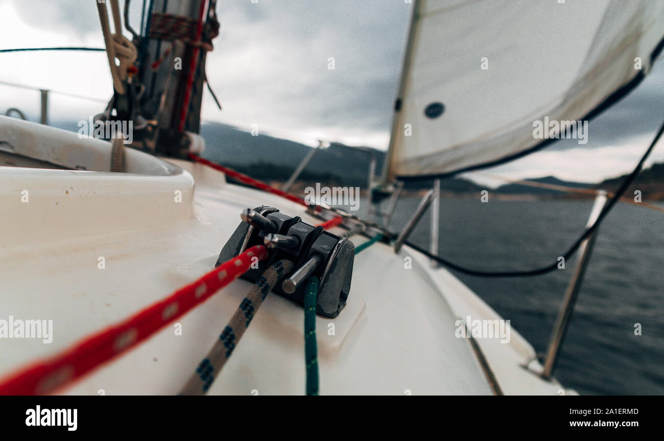 Sailing in a vessel between mountains and going ahead to the storm. Detail of the stopper Stock Photo