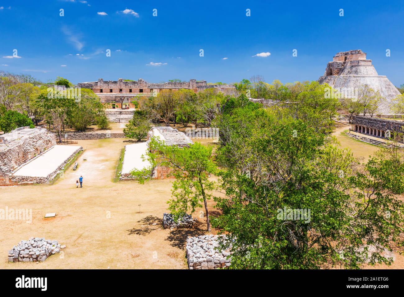 Uxmal, Mexico. The court of the Mesoamerican ball game and Pyramid of Magician. Stock Photo