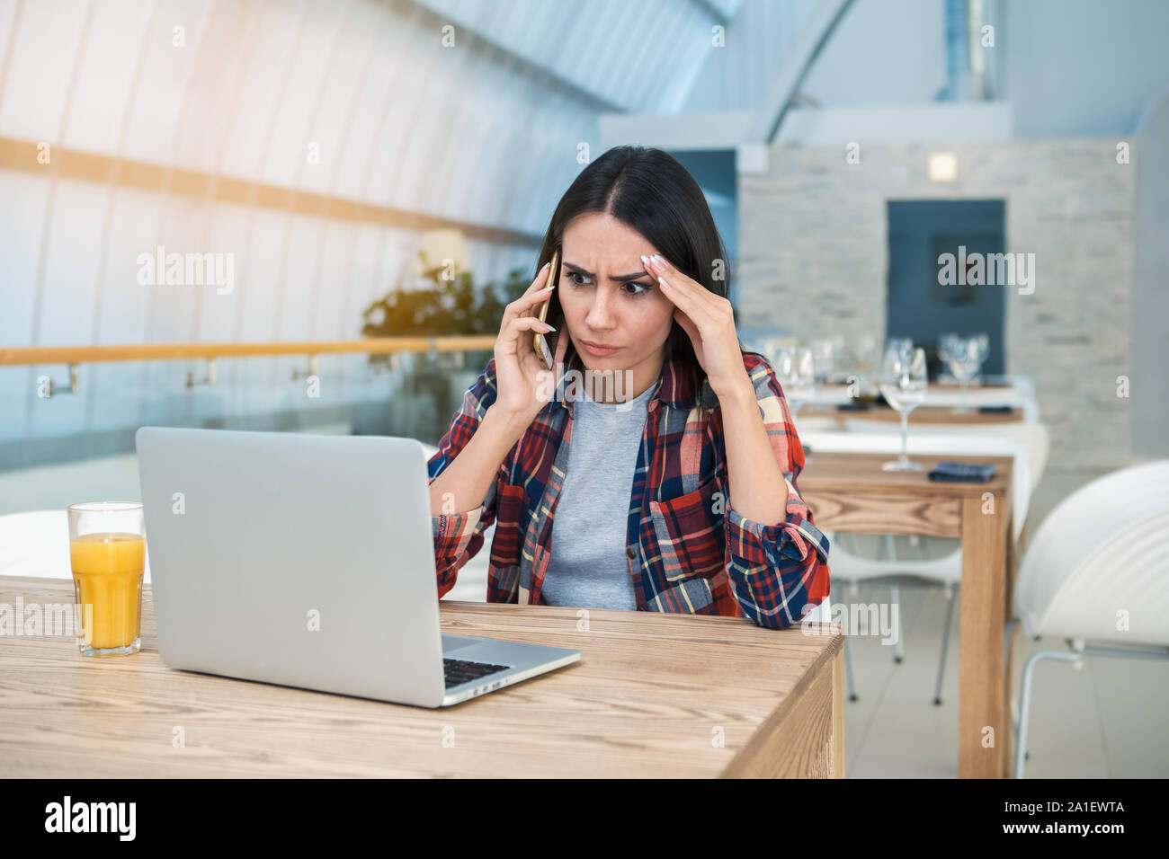 Young Woman Sitting in the Restaurant Browsing Laptop Concept Stock ...