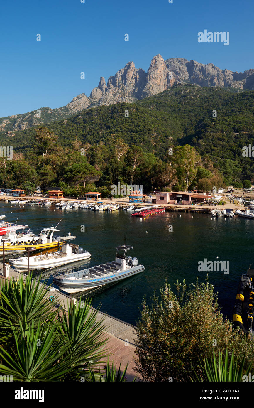 The tourist boats and Capu d'Orto in Marine de Porto / Porto marina Porto  Ota on the Gulf of Porto UNESCO world heritage site in western Corsica  Stock Photo - Alamy