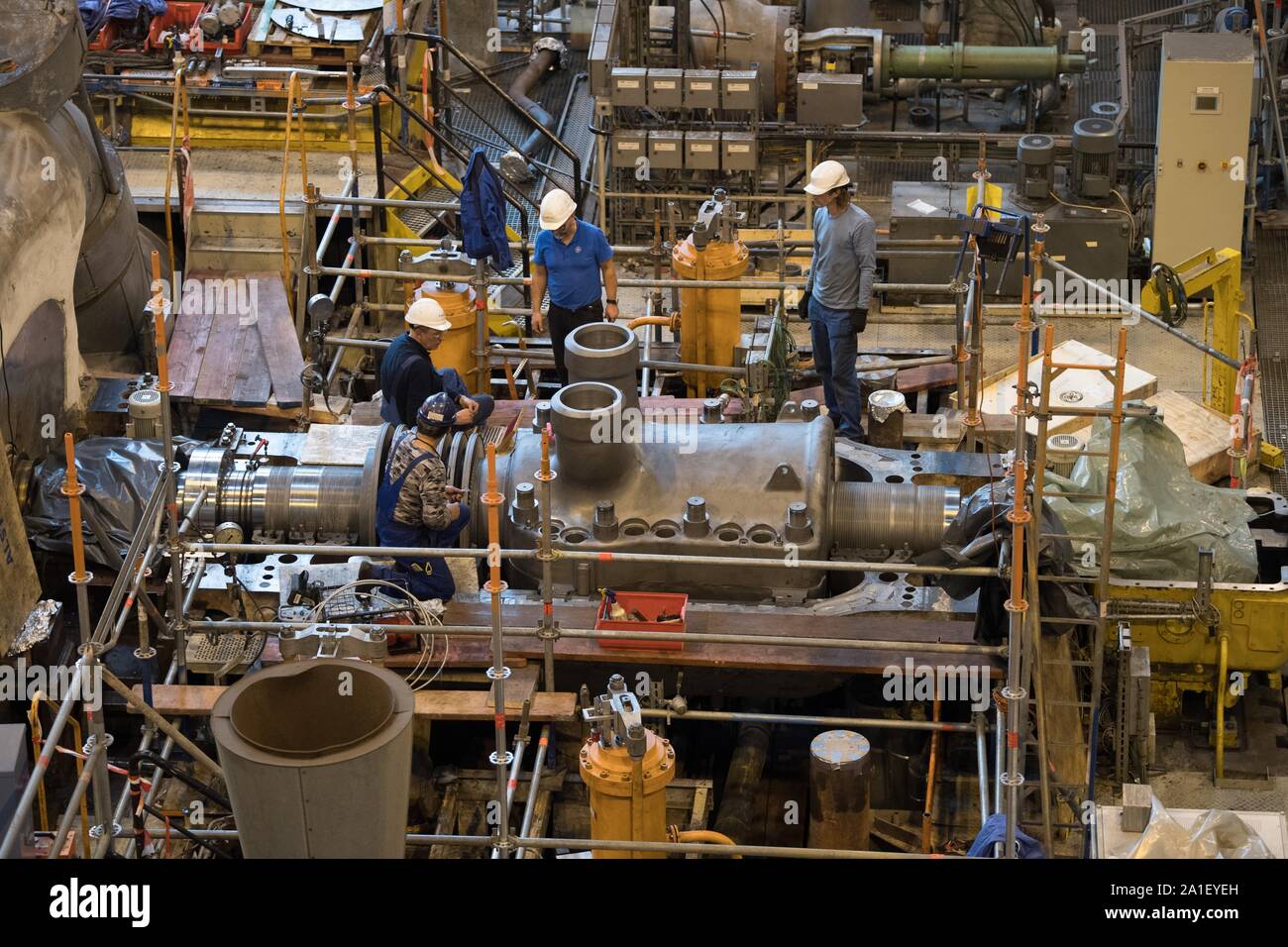 Boxberg, Germany. 26th Sep, 2019. Employees of service companies are  engaged in repair and maintenance work on a high-pressure turbine in power  plant unit N of Boxberg power plant. The block will