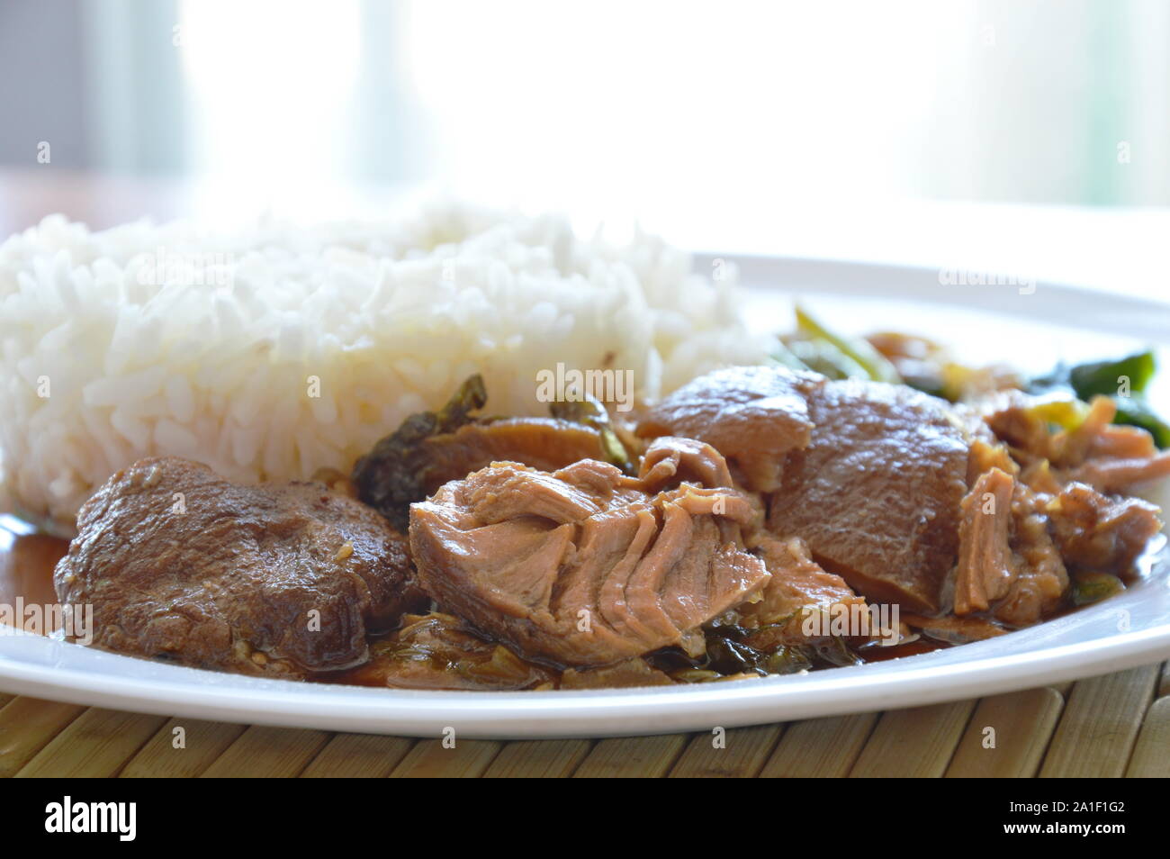 Stew Pork Rice pork leg stewed with rice on dish Stock Photo - Alamy