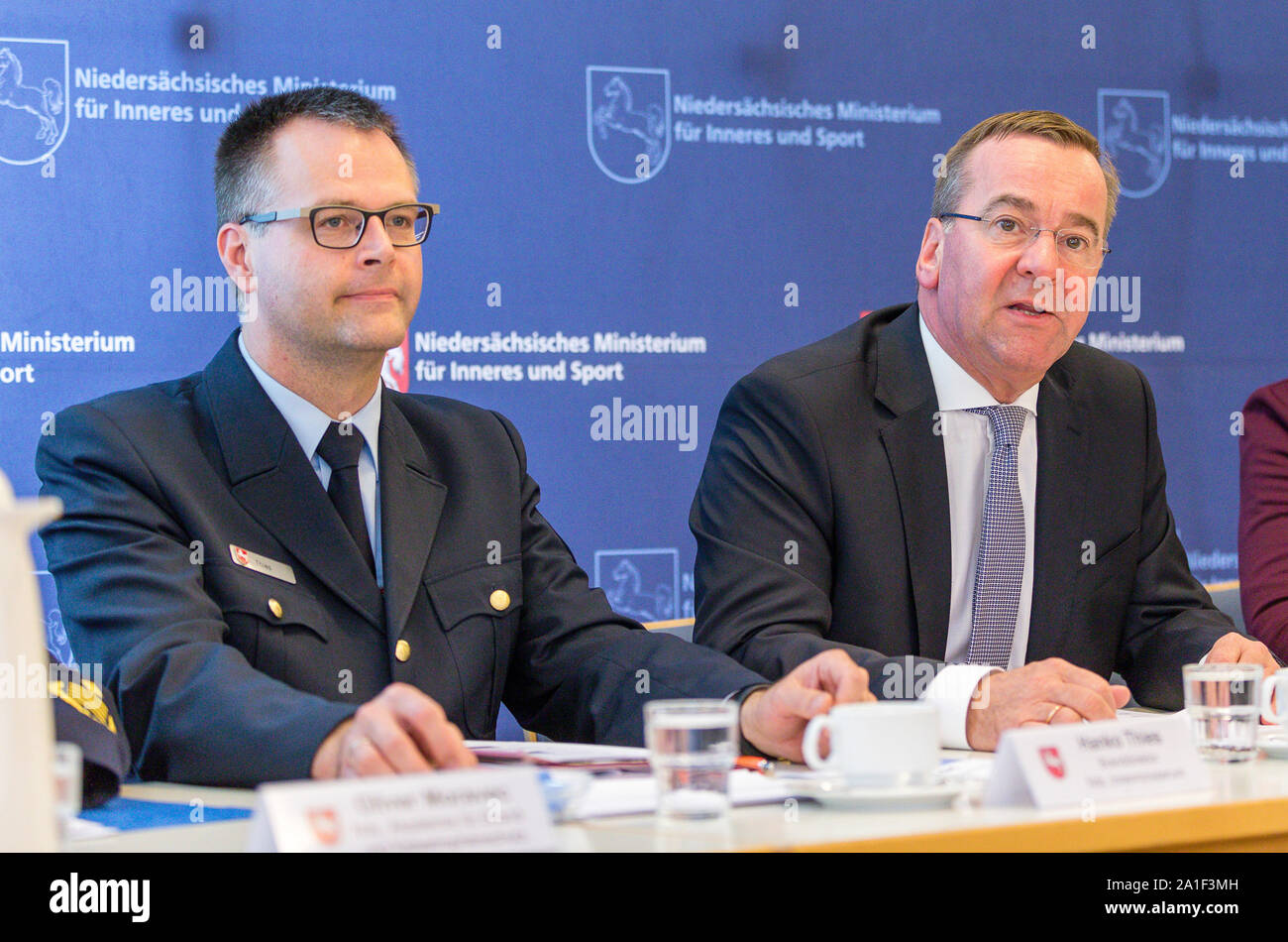 Rastede, Germany. 26th Sep, 2019. Hanko Thies, Fire Director Interior Ministry and Boris Pistorius (SPD), Interior Minister Lower Saxony, speak at a press conference at the Academy for Fire and Disaster Protection. Pistorius presented the activity report of the fire brigade of Lower Saxony for the year 2018. Credit: Martin Remmers/dpa/Alamy Live News Stock Photo