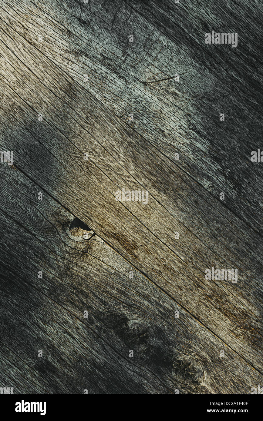 Grunge worn wooden surface texture with shadow pattern from above Stock Photo