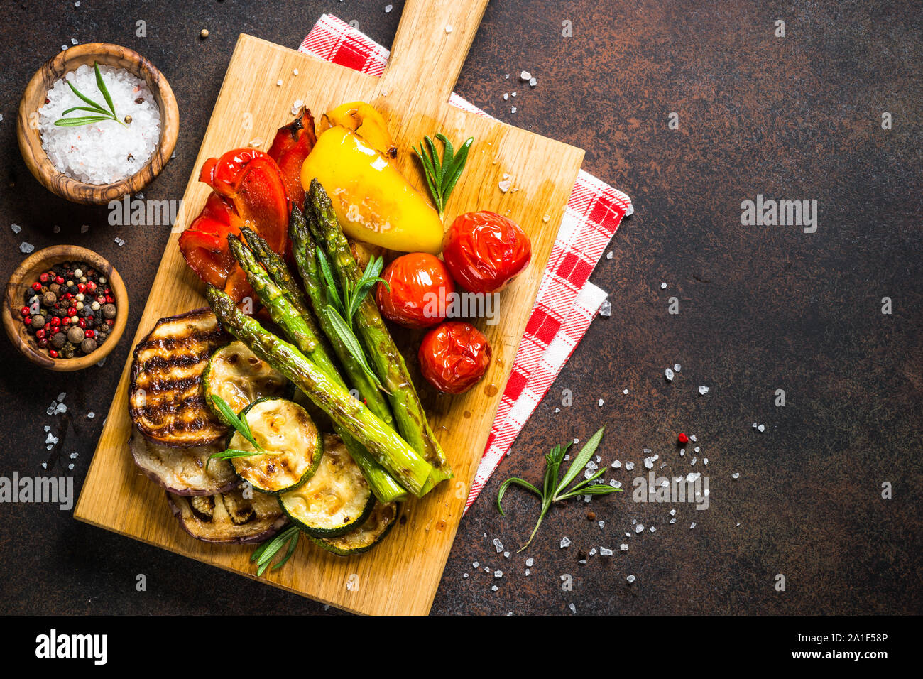 Grilled vegetables - zucchini, paprika, eggplant, asparagus and tomatoes. Stock Photo