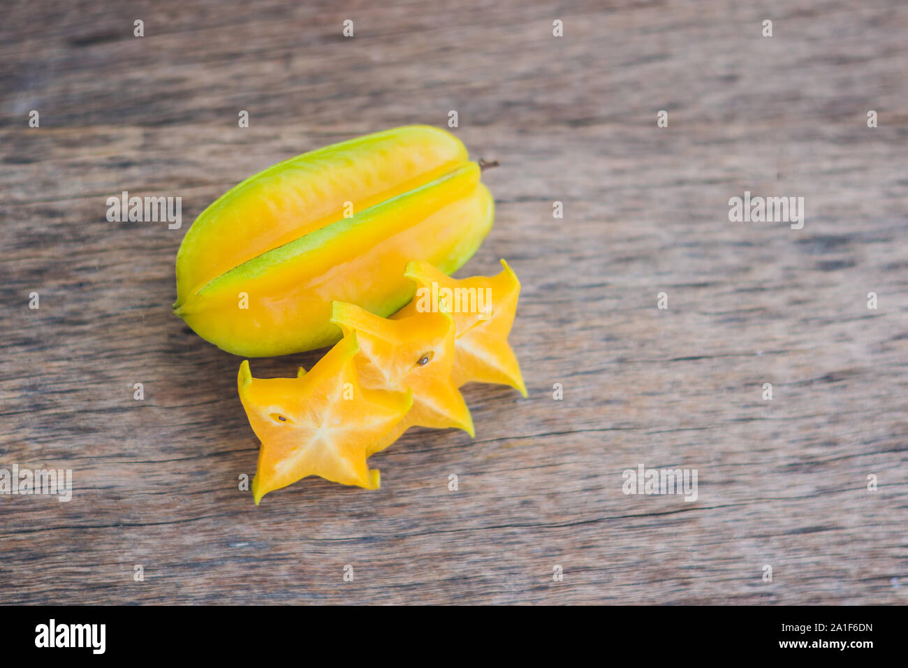 Star fruits on wooden table. Thai fruit : Star fruit is popular in asia, sweet taste fruits. Star fruits sliced on wood background. Selective focus Stock Photo - Alamy Star fruits on wooden table. Thai fruit : Star fruit is popular in asia, sweet taste fruits. Star fruits sliced on wood background. Selective focus Stock Photo - Alamy