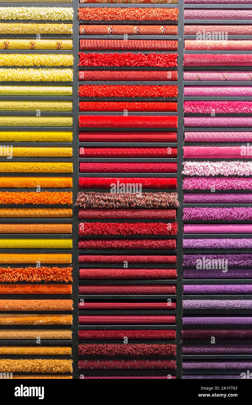multicolored carpets samples on showcase Stock Photo