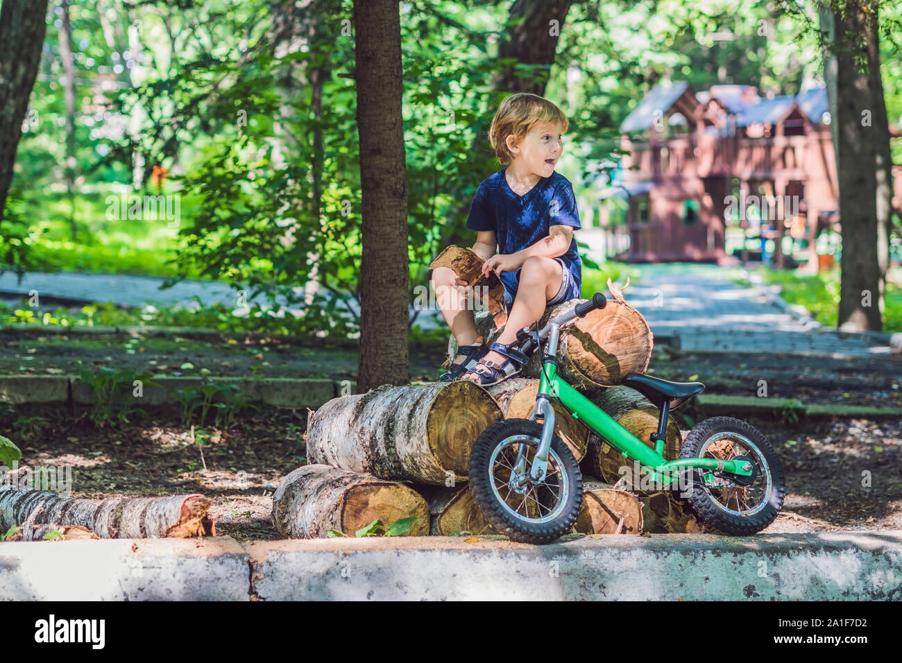 Little boy and his bicycle. Preschool child's first day on the bike. The joy of movement. Stock Photo