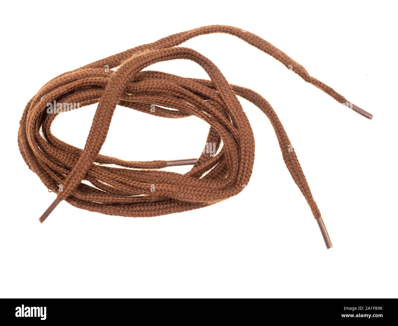 Pair of classic flat brown shoe laces isolated on white background