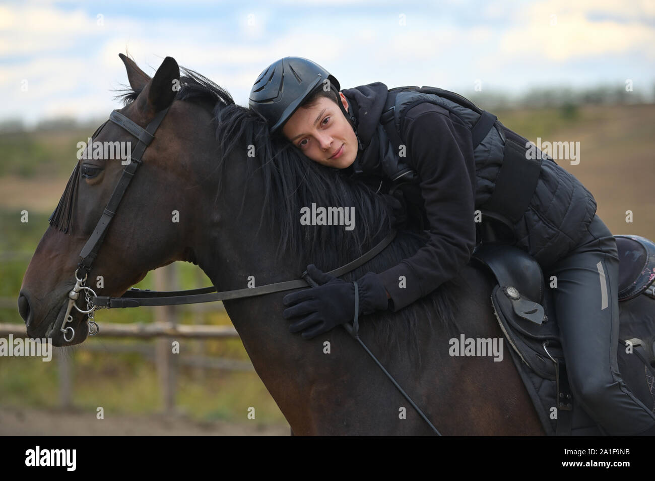 Teenage boy with a horse in nature Stock Photo