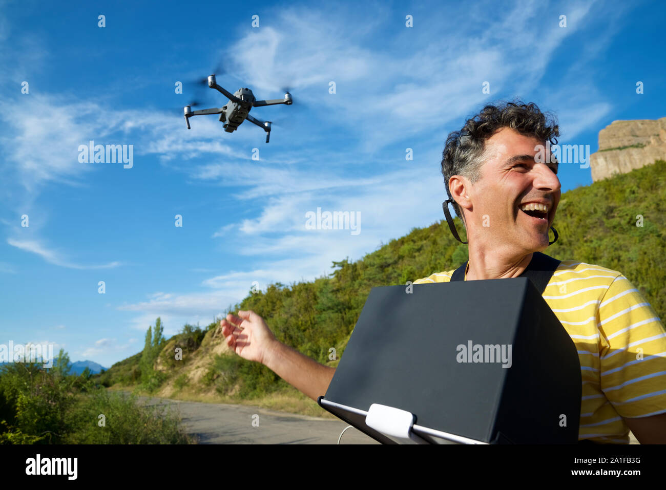 A man driving a drone in the Pyrenees. Stock Photo