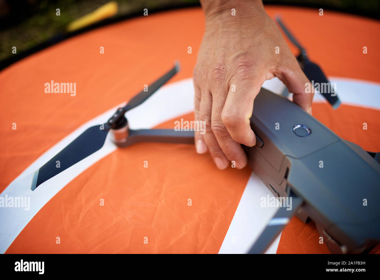 Close-up of a man preparing a drone to fly. Stock Photo