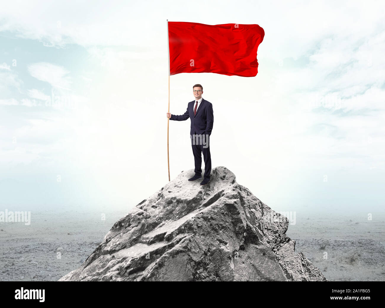 Handsome businessman on the top of the mountain with red flag Stock ...