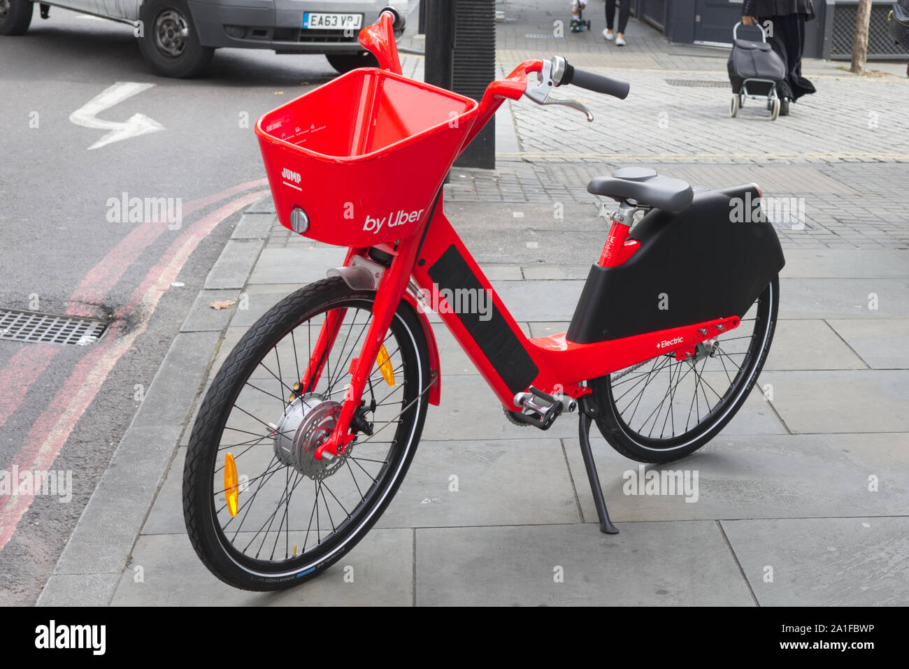 Uber, bright red Jump, electric bike Stock Photo
