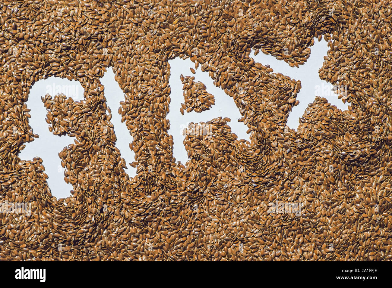 flax word made from flax seeds on white artist canvas Stock Photo - Alamy