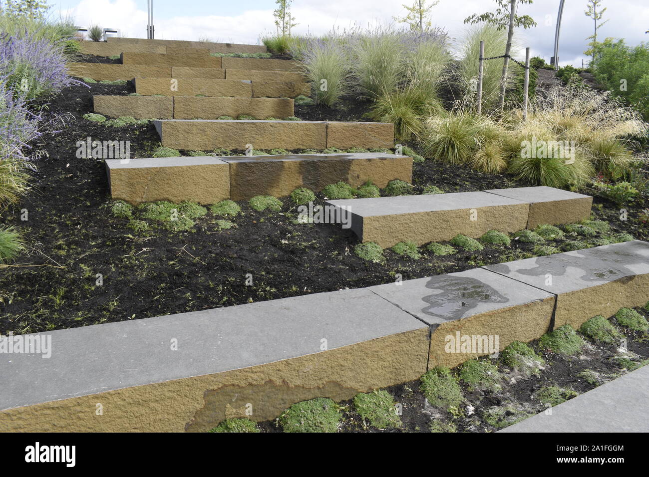 Large rectangler stone blocks form a garden feature and an adventursous staircase at the west end of Vancouver Waterfront Park. Stock Photo