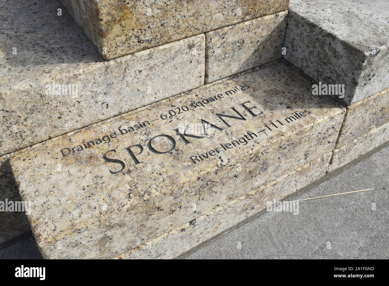 The stone blocks that make up the new Columbia River Water feature at Vancouver Waterfront Park are inscribed with drainage basin details. Stock Photo
