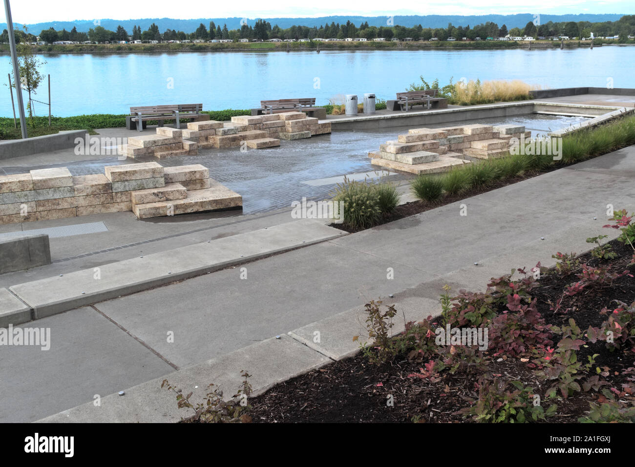 Water Flows Out Cracks In The Stone Blocks Of New Columbia River Water Feature At Vancouver Waterfront Park The Fountain Sits Next To The River Stock Photo Alamy