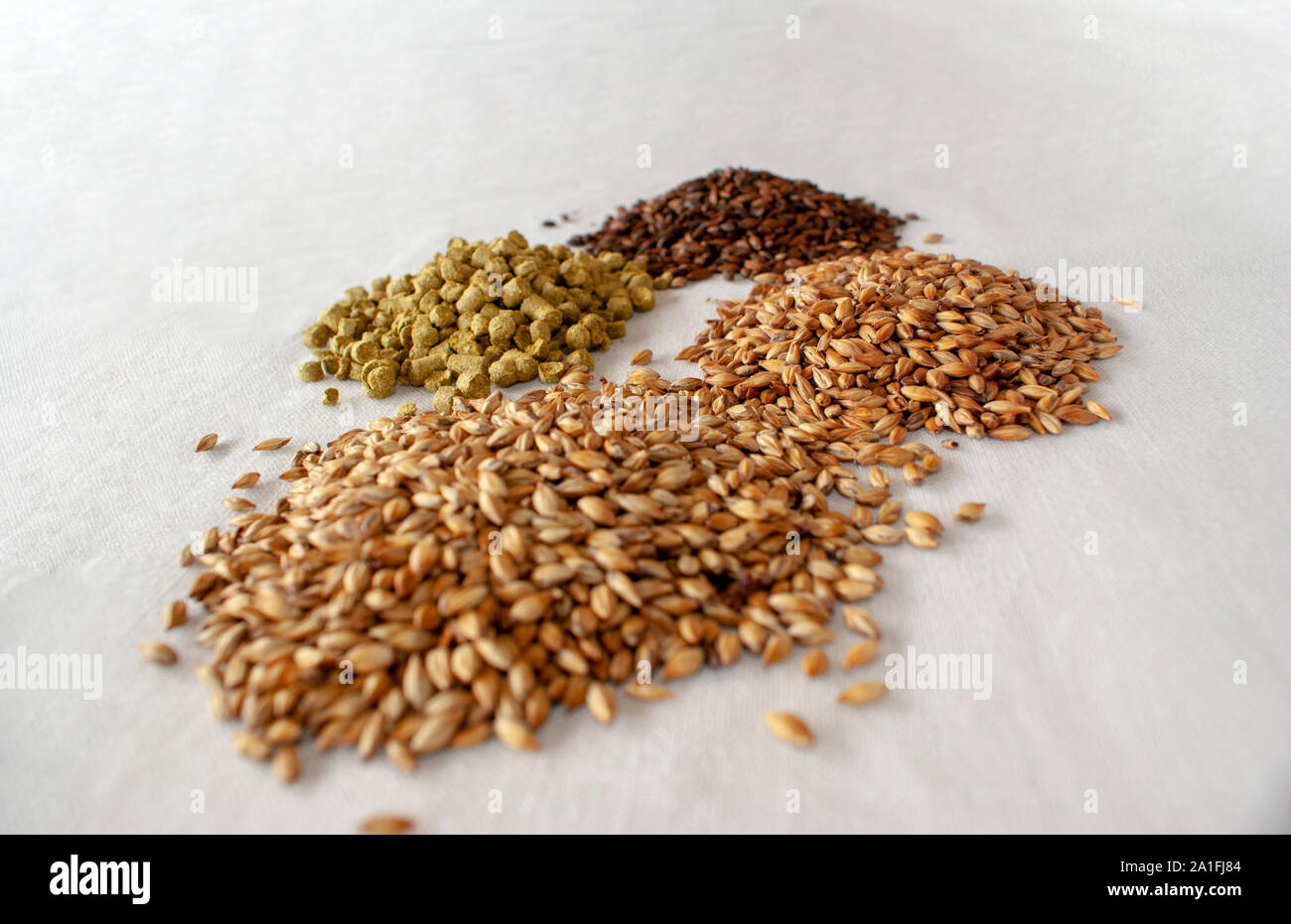 an amber lager pale ale beer and its component over a withe background