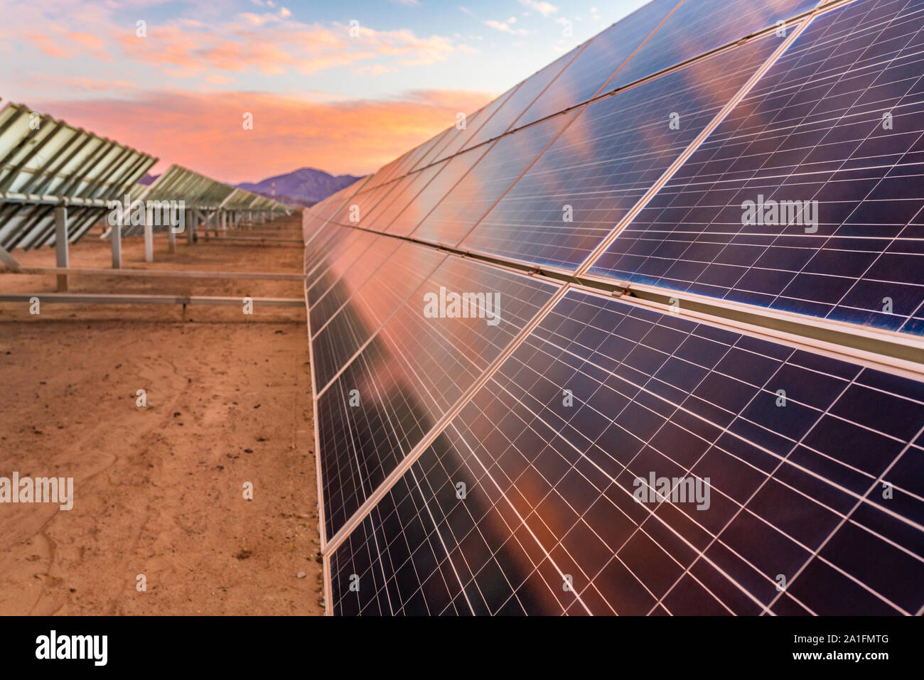 Hundreds solar energy  panels rows along the dry lands at Atacama Desert, Chile. Huge Photovoltaic PV Plant in the middle of the most arid desert Stock Photo