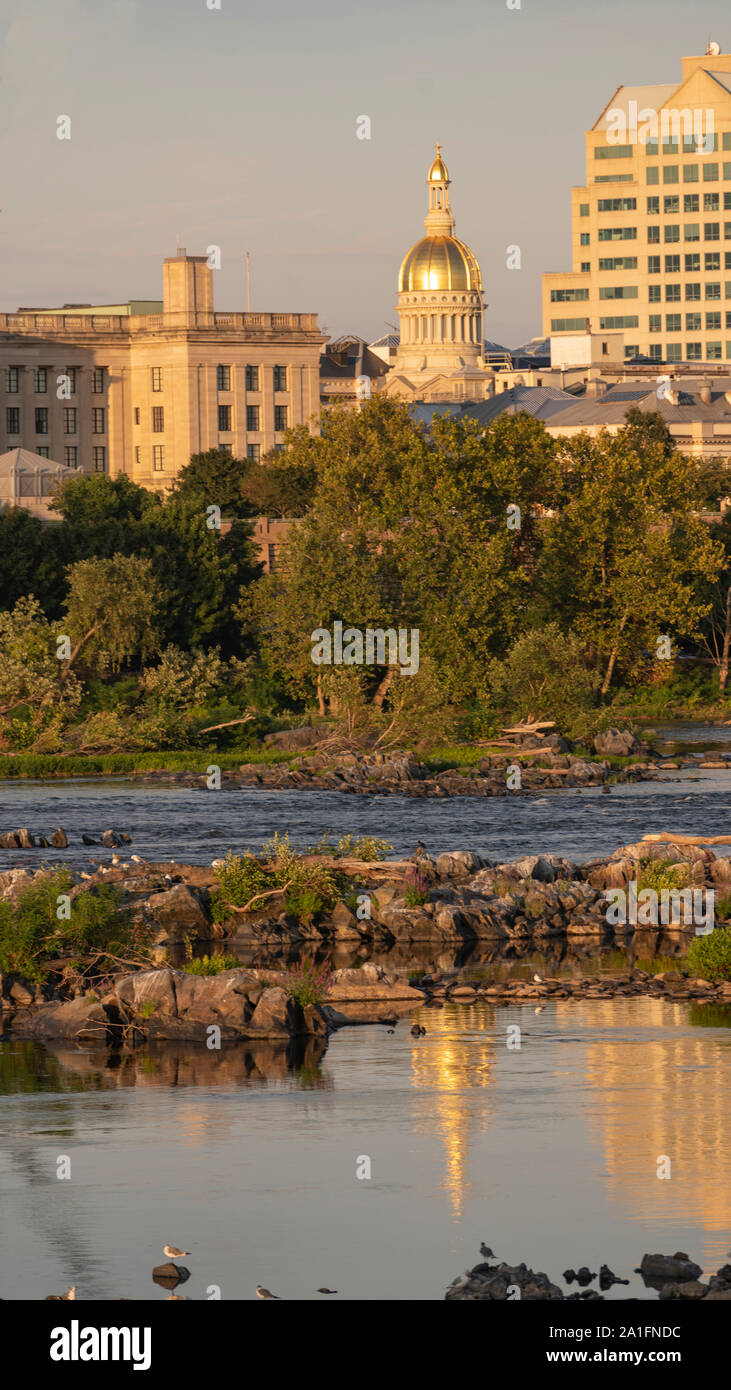 The capital statehouse of New Jersey reflects in the Delaware River in the city of Trenton Stock Photo