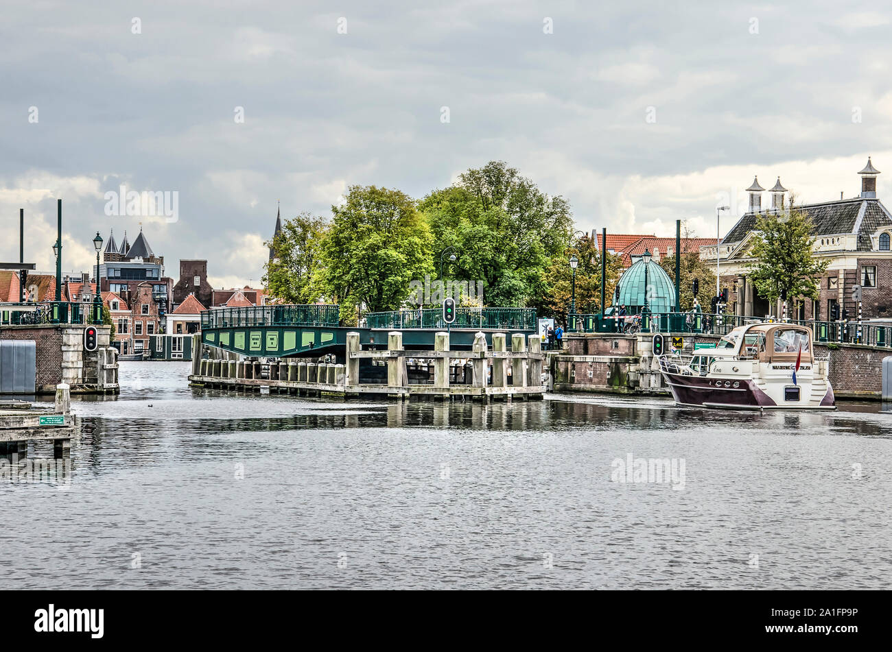 Haarlem, The Netherlands, September 9, 2019: Catharijne bridge across the Spaarne river rotates open to let a small yacht pass Stock Photo