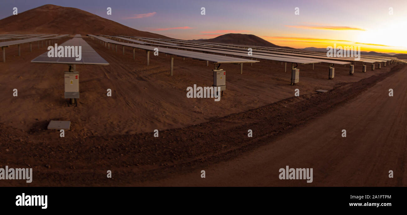 Hundreds solar energy  panels rows along the dry lands at Atacama Desert, Chile. Huge Photovoltaic PV Plant in the middle of the most arid desert Stock Photo