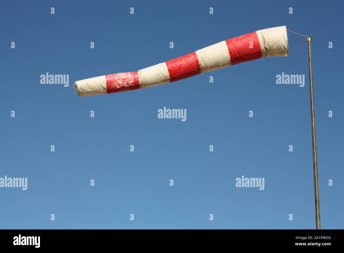 Windsock. Instrument for measuring wind speed and direction Stock Photo
