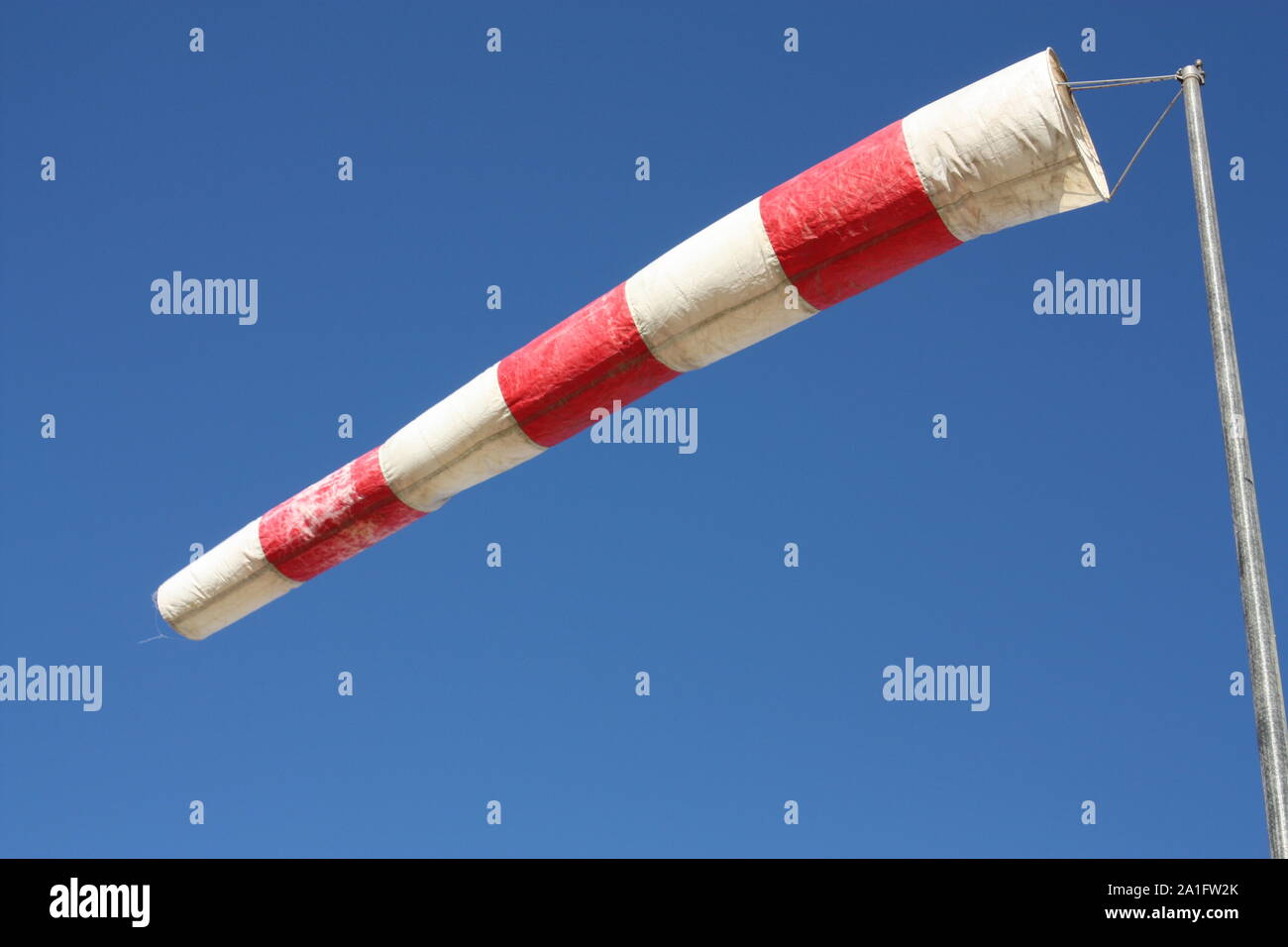 Windsock. Instrument for measuring wind speed and direction Stock Photo