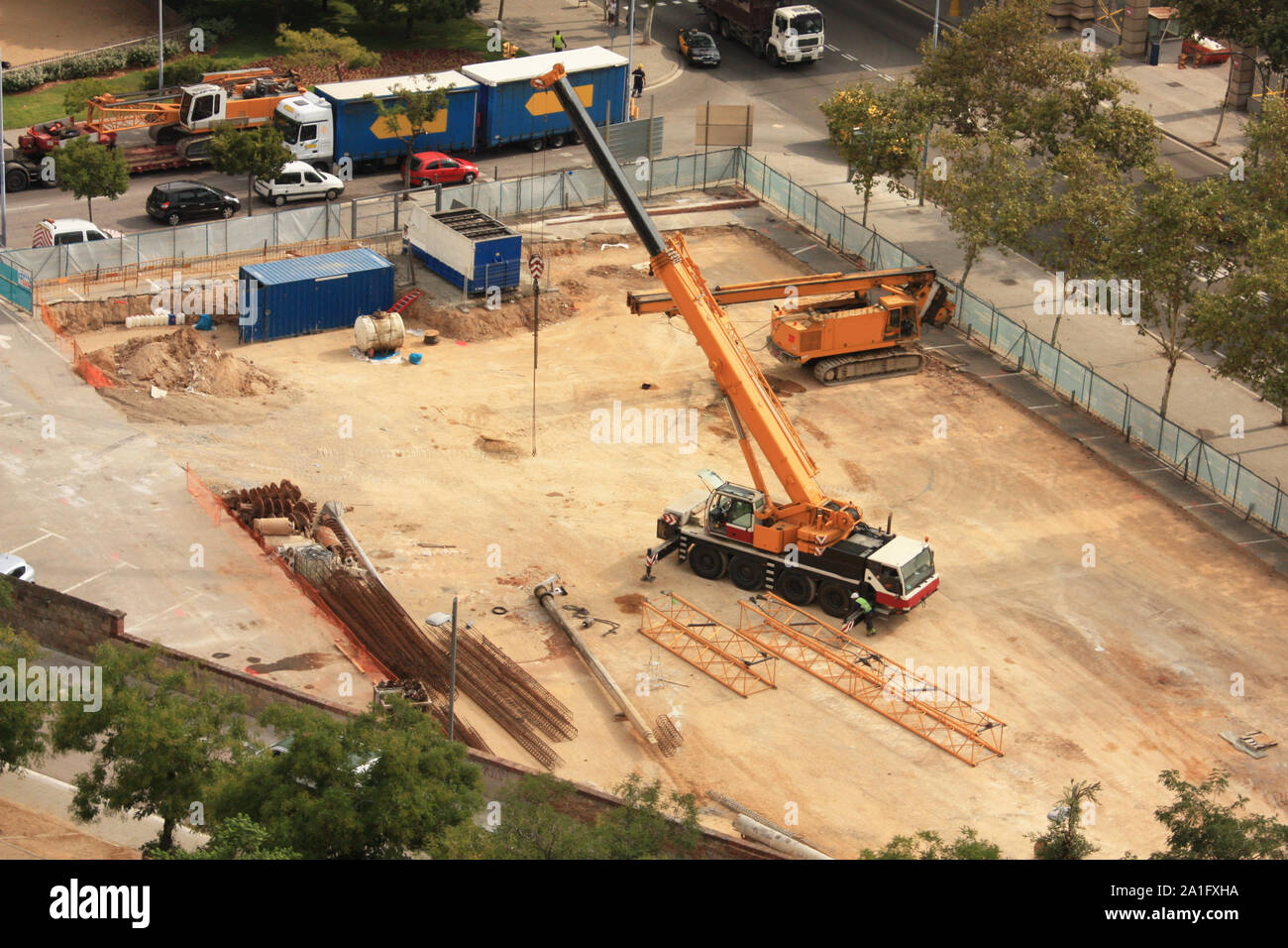 Machines working on a building site, on a street in Barcelona, Spain. Stock Photo