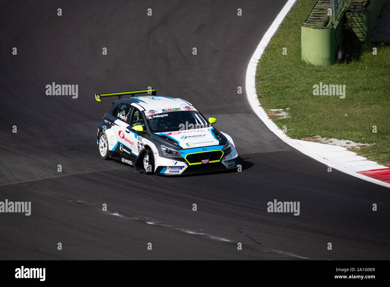 Vallelunga, Italy september 14 2019. Cupra damaged with flat tire high angle view at turn in racing circuit Stock Photo