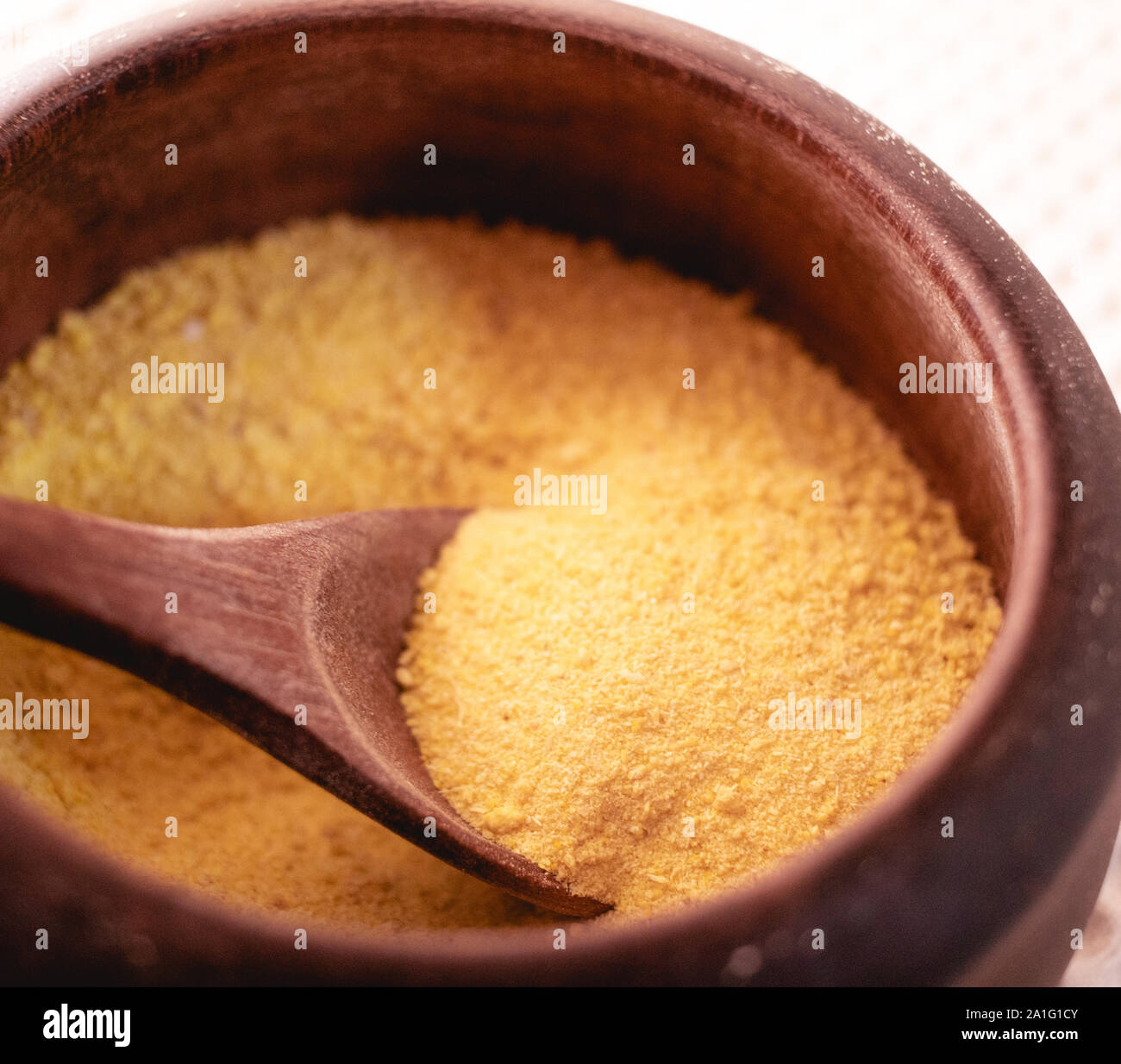 Picture of a wooden pot with manioc flour Stock Photo