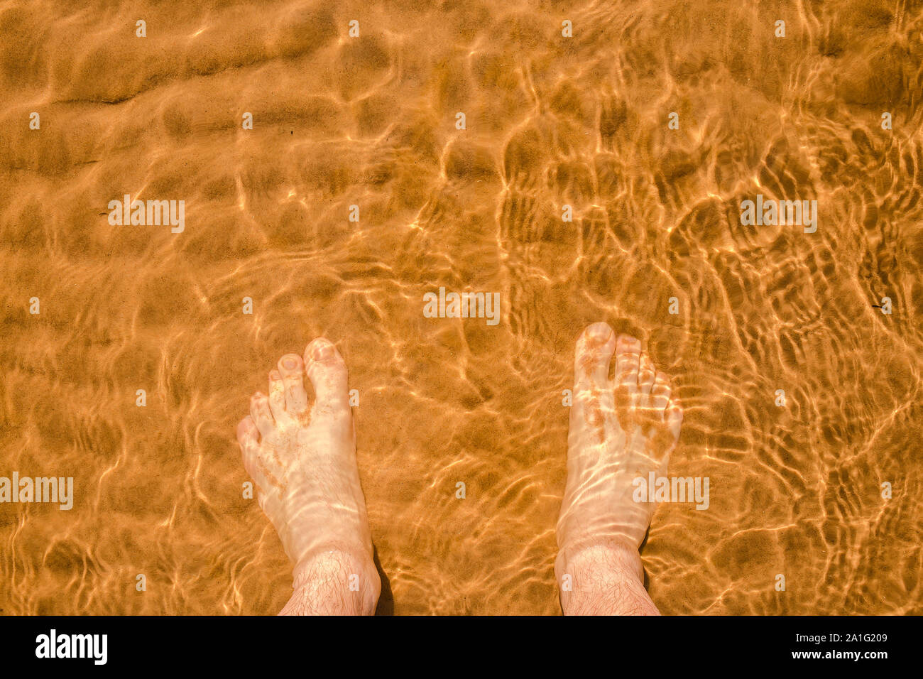 Male feet walking on sand hi-res stock photography and images - Alamy