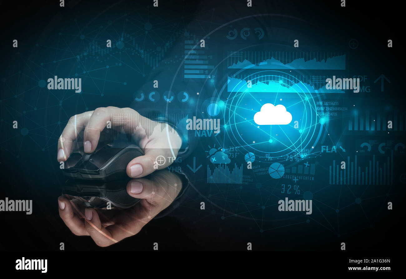 Hand using wireless mouse with cloud technology concept and dark background Stock Photo