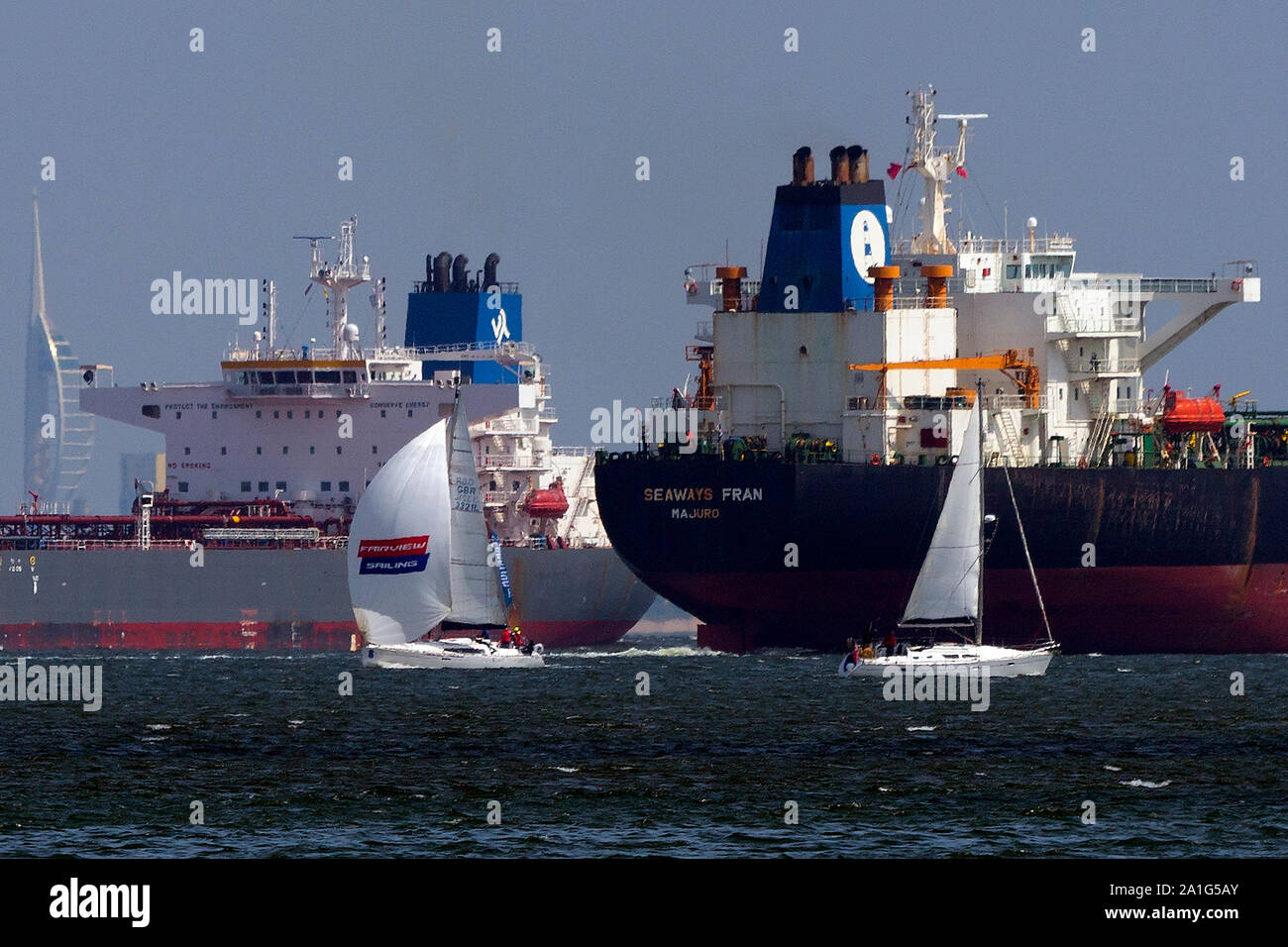 busy,shipping,lane,lanes,Oil tankers,passing,very,close,to,yachts,The Solent,Fawley,Refinery,Cowes,Isle of Wight,England,UK, Stock Photo